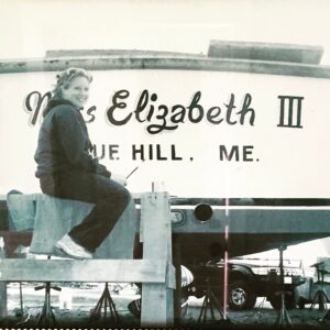 Elizabeth painting the letters on the Miss Elizabeth III